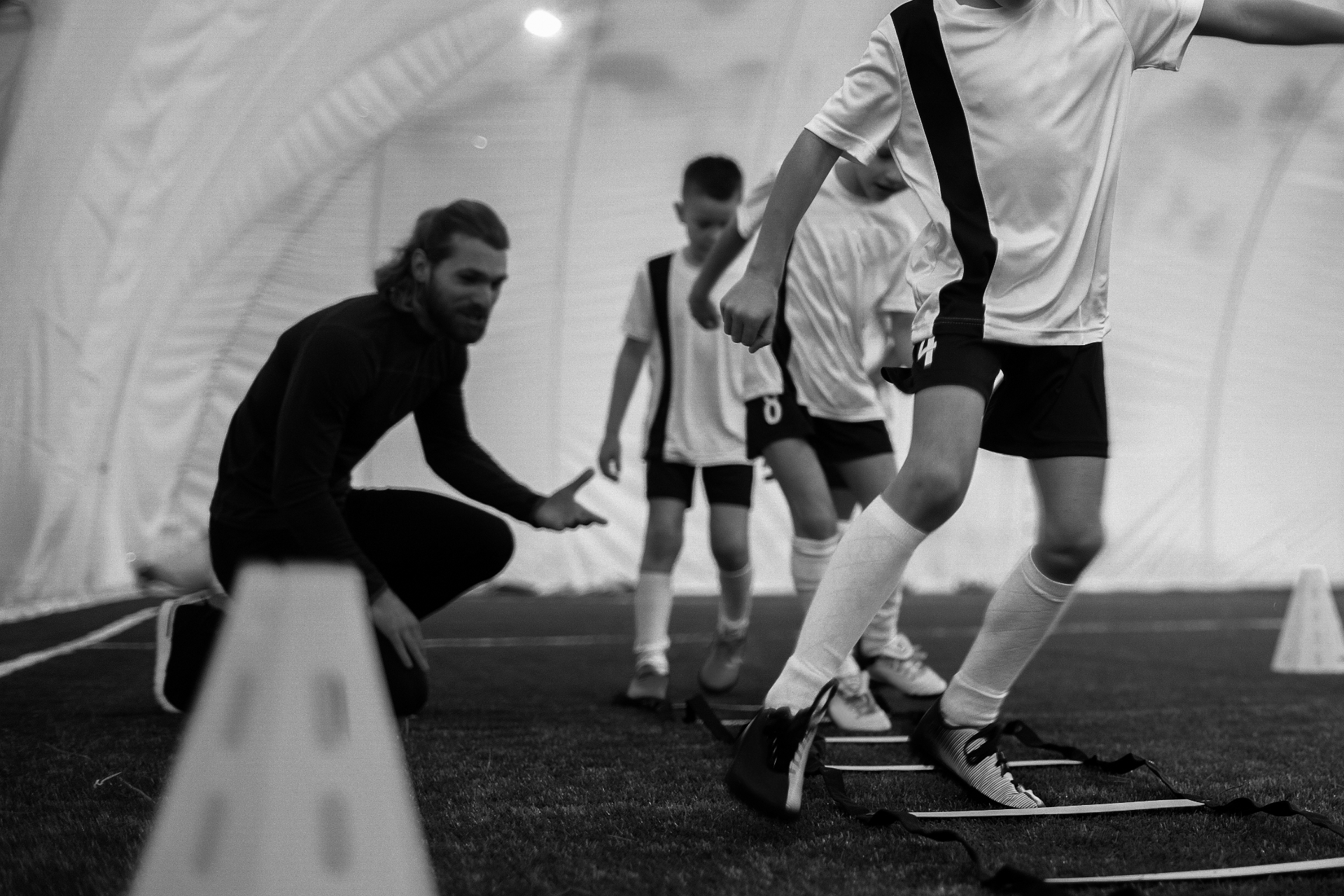Coach mentoring a young player